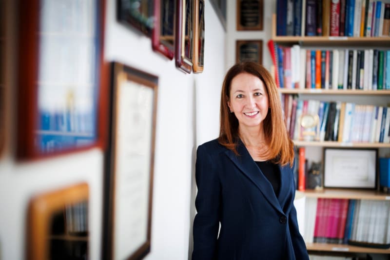 Smartphone displaying mental health therapy app interface with calming design elements and progress tracking