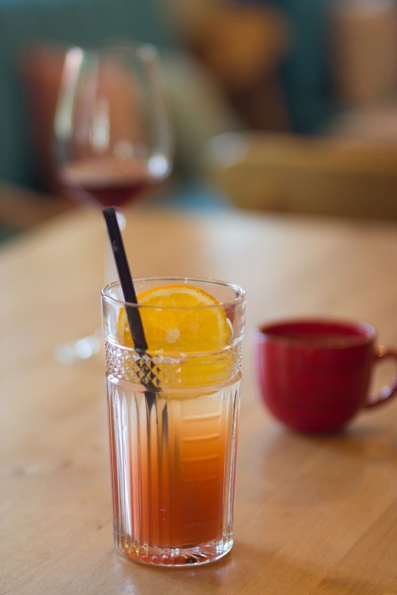 Wine glasses and beer bottles next to cancer awareness ribbons representing alcohol-related health risks