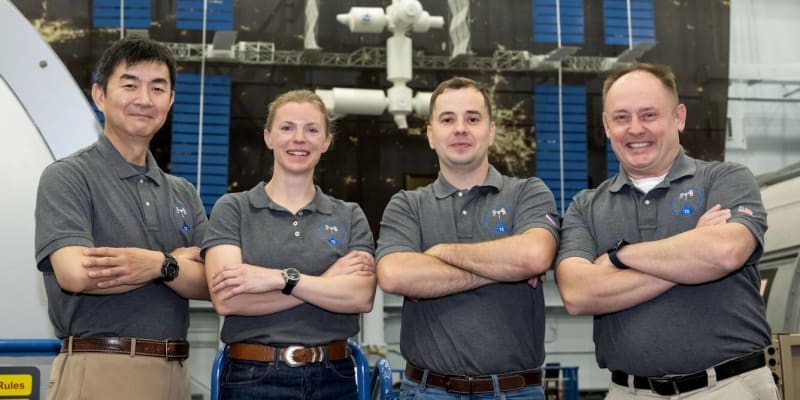 SpaceX Dragon capsule approaching International Space Station against backdrop of Earth's blue horizon