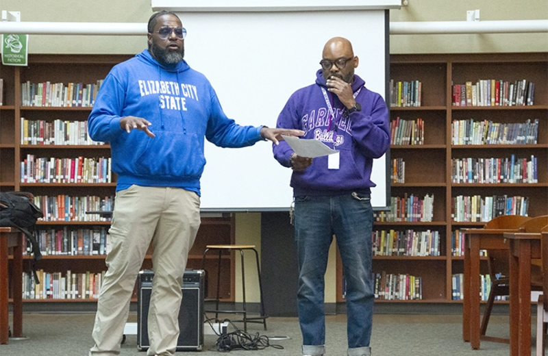 Principal Tarance Hart and organizer Chukundi Salisbury lead community meeting at Garfield High School in Seattle