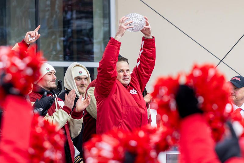 Fans cheering at packed Memorial Stadium during Indiana football championship celebration in cold weather