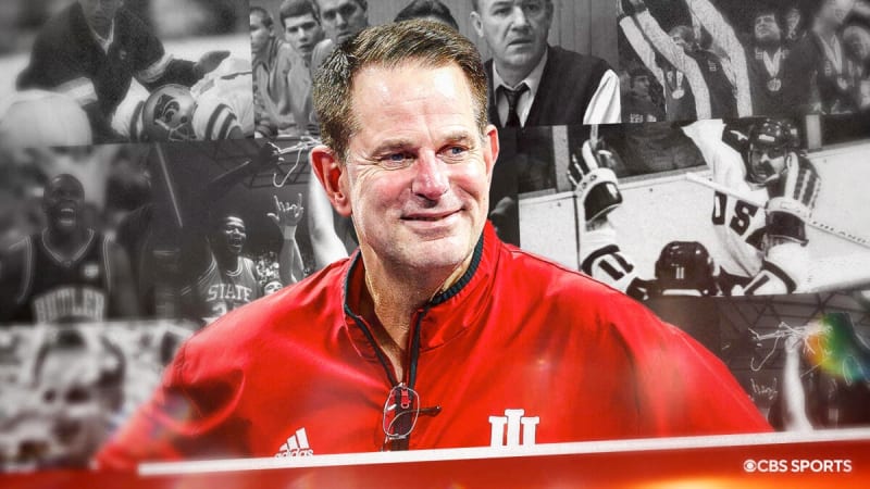 Indiana Hoosiers football coach Curt Cignetti leading his undefeated team onto the field