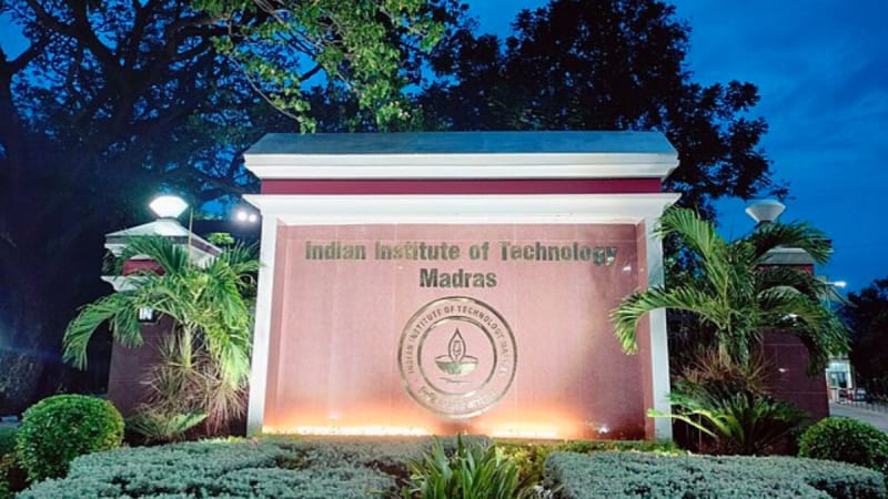 Modern glass building of Dubai CommerCity innovation hub with futuristic skyline backdrop