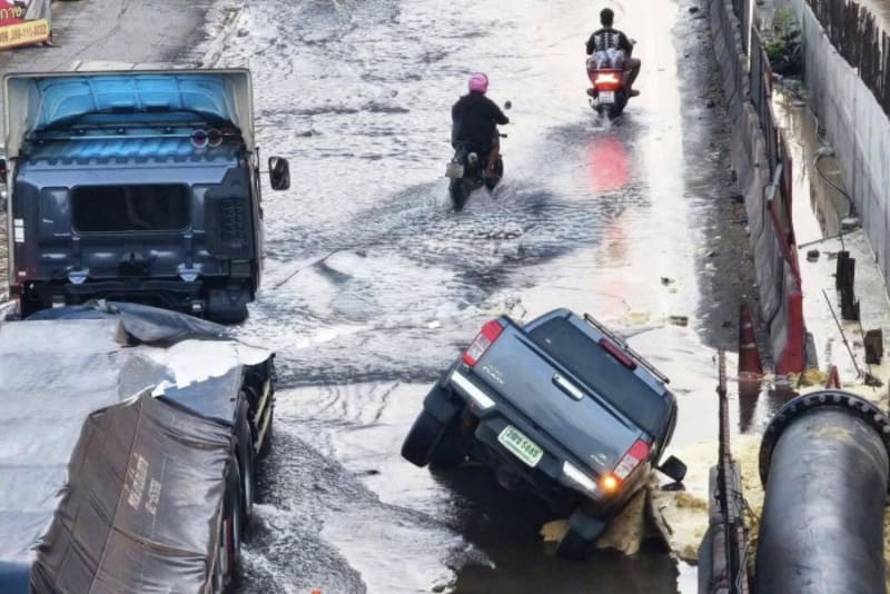 ** Construction crane and safety equipment at building site in Thailand showing new safety protocols