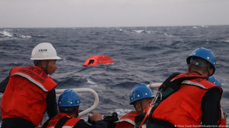 ** Chinese Coast Guard vessels conducting rescue operation in South China Sea waters