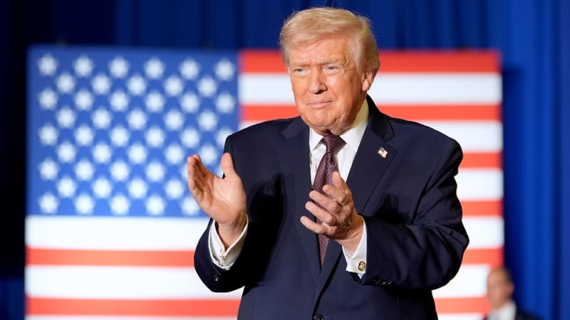 Parent holding colorful vape device designed to appeal to children with candy flavors