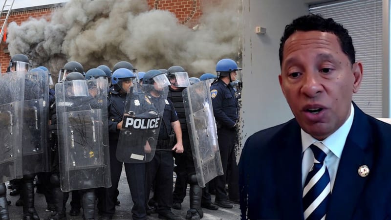 Baltimore city skyline at sunset showing downtown buildings and Inner Harbor waterfront area