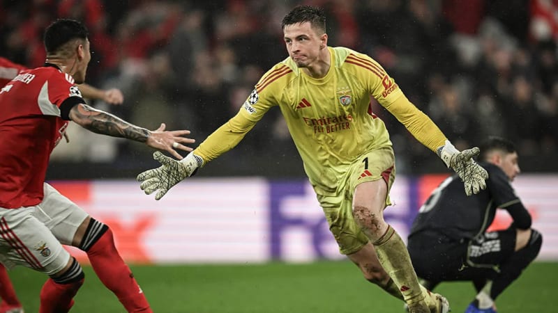 Benfica goalkeeper Anatoliy Trubin celebrating with teammates after scoring dramatic header goal against Real Madrid