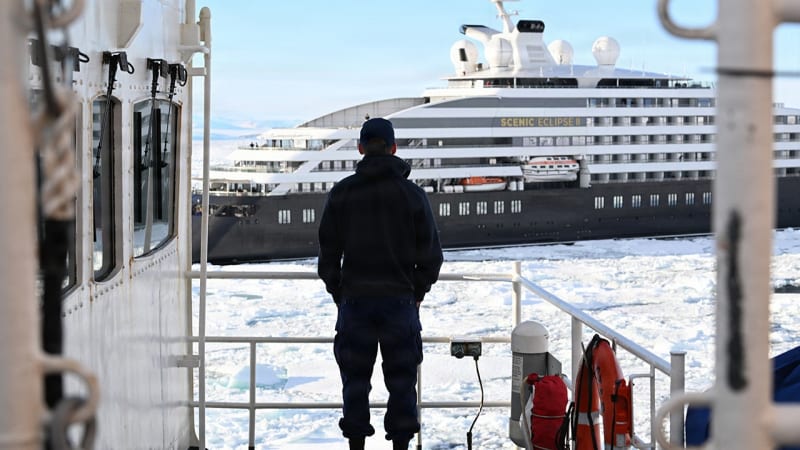 US Coast Guard icebreaker Polar Star breaking through thick white Antarctic pack ice