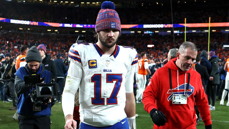 Josh Allen walking off field after Bills playoff loss to Broncos in Denver