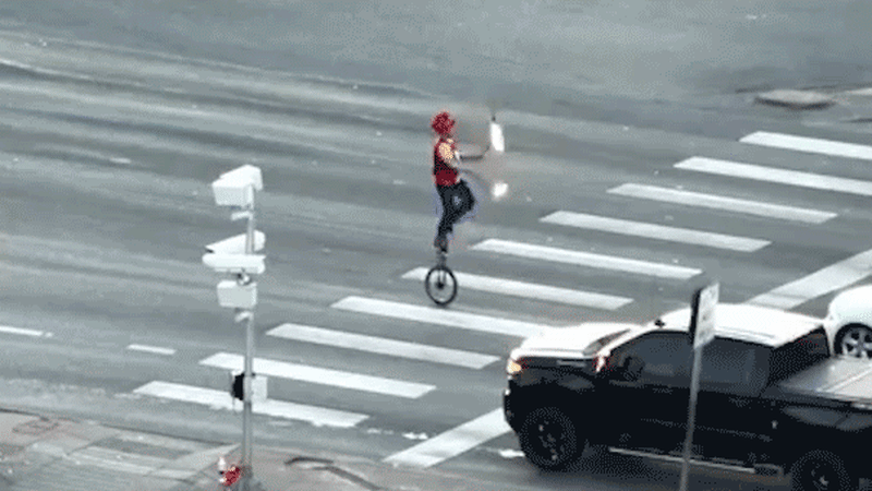Fire Juggler on Unicycle Stops Colorado Traffic
