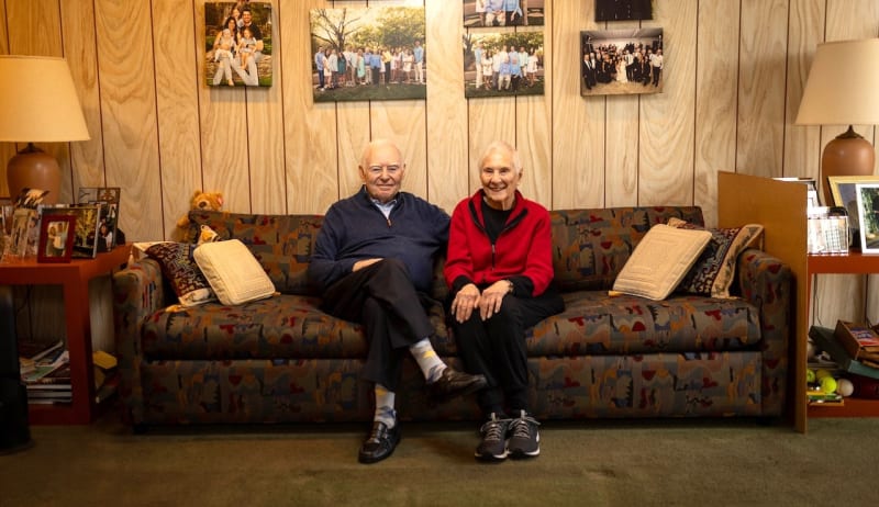 SuperAger Ralph Rehbock sitting with his wife at home, showing mental sharpness at 80