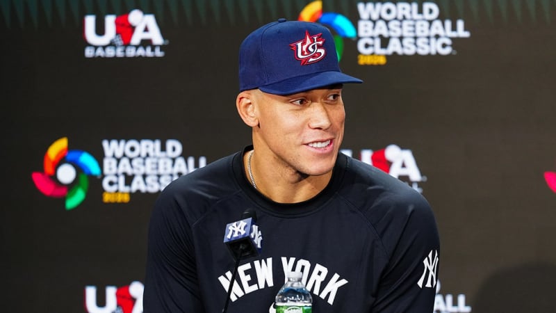 Aaron Judge in Team USA baseball uniform speaking to media after being named WBC captain