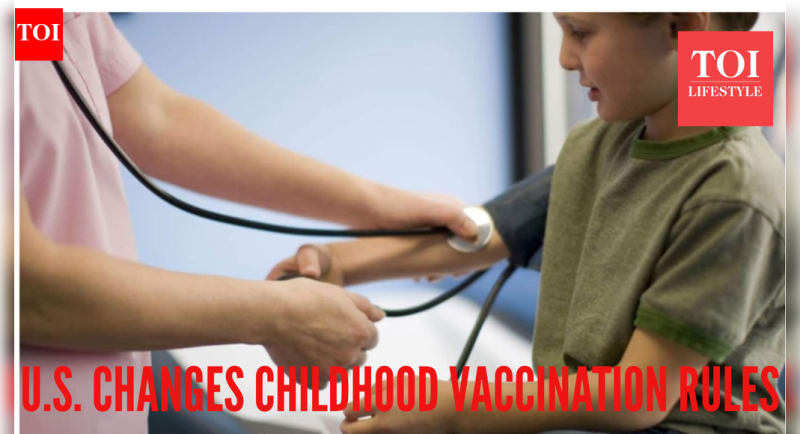 Doctor consulting with parents about child's personalized vaccination schedule in warm, welcoming medical office setting