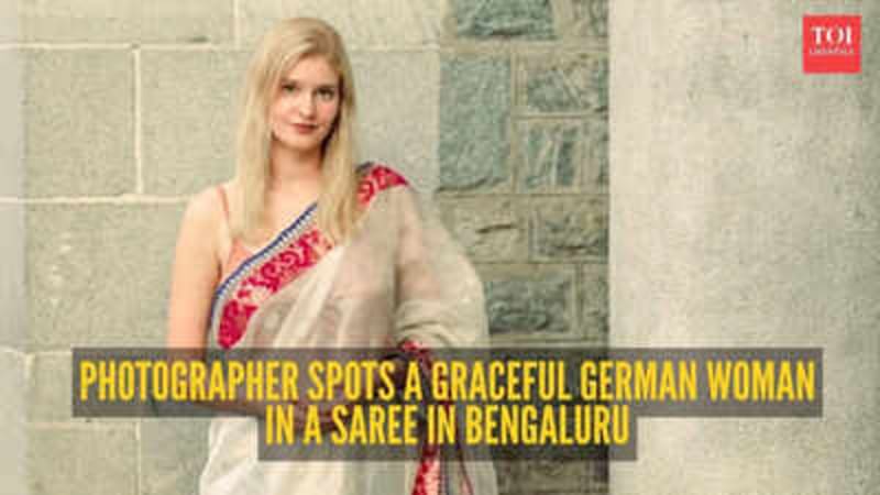 German woman wearing traditional Indian saree walking casually on Bengaluru street