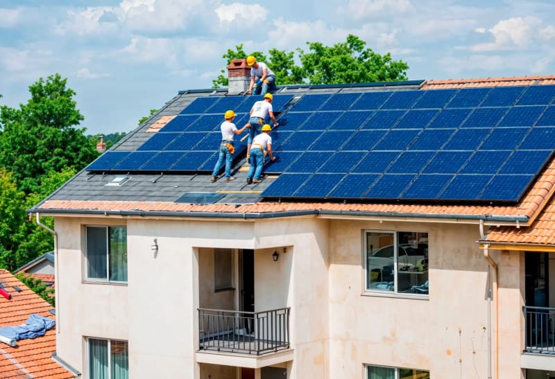 Solar panels installed on rooftop generating clean renewable energy for home self-consumption