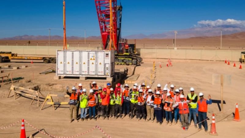 ** Large industrial battery storage units being installed at Chilean renewable energy facility