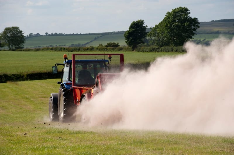 Pulverized volcanic rock spread across green farmland to capture carbon dioxide naturally