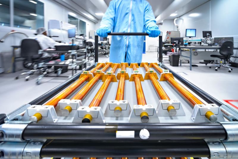 Microscopic view of beneficial microbes working together on mineral rich copper ore in mining heap