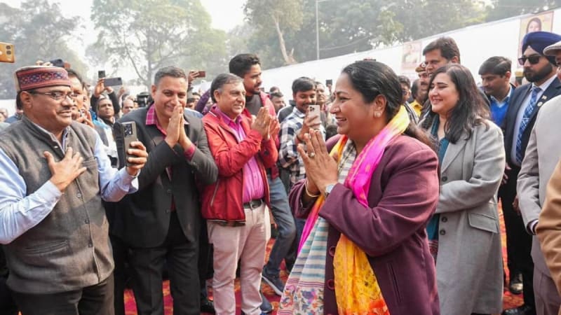 Aerial view of Delhi slum neighborhood with colorful rooftops and narrow pathways between homes