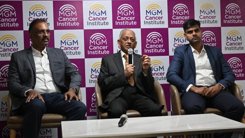 Medical team of oncology specialists consulting together in hospital, representing collaborative cancer care and successful patient outcomes