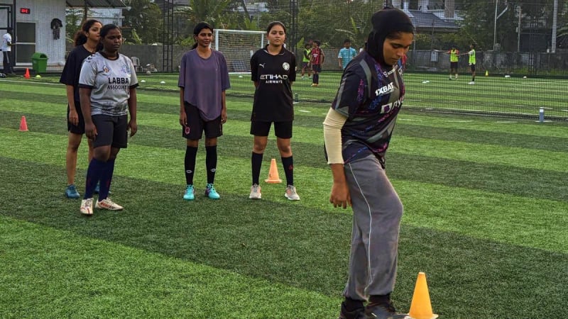 Women playing football together on turf during Do Culture beginner sports session in Kochi