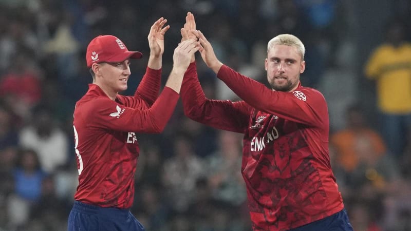 Cricket players celebrating on field during T20 World Cup match action