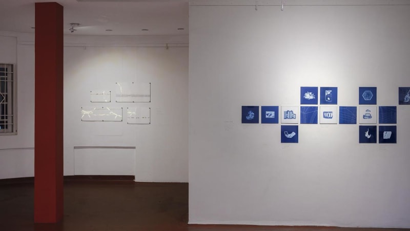 Delicate white paper woven sculpture resembling fragile nest honors migrant construction workers