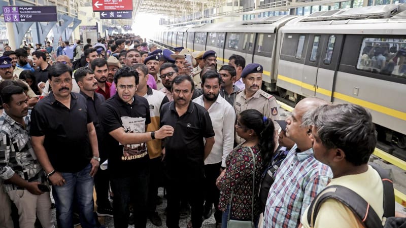 Crowded metro platform in Bengaluru with commuters waiting for train arrival