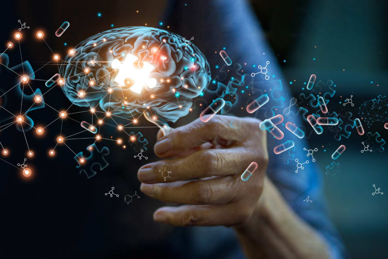 Doctor reviewing brain scan showing dopamine levels in Parkinson's disease patient at UConn Health