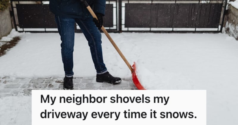 ** Man shoveling snow from residential driveway on winter morning
