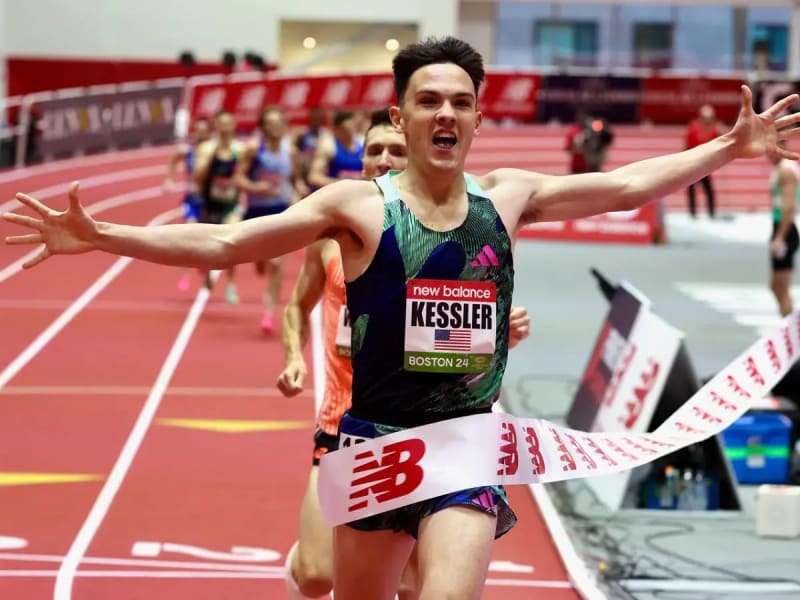 Hobbs Kessler racing on indoor track in USA uniform at New Balance Grand Prix