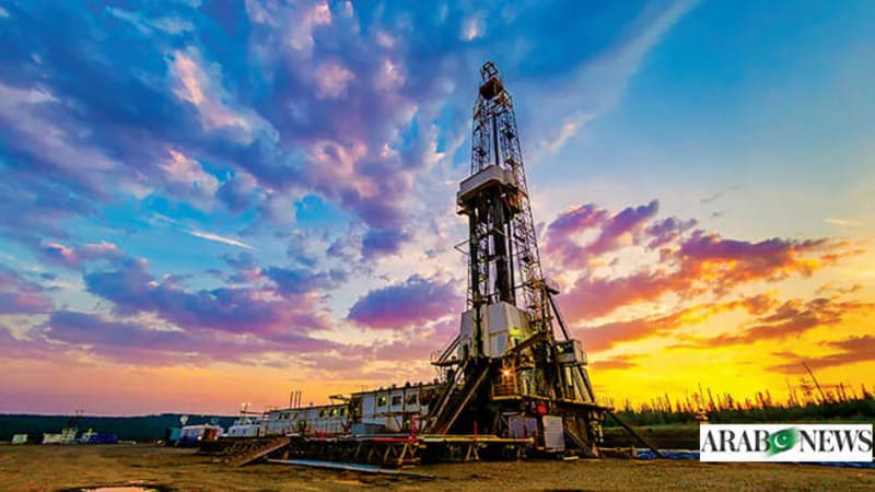 Solar panels and wind turbines in desert landscape representing Saudi Arabia's renewable energy transition