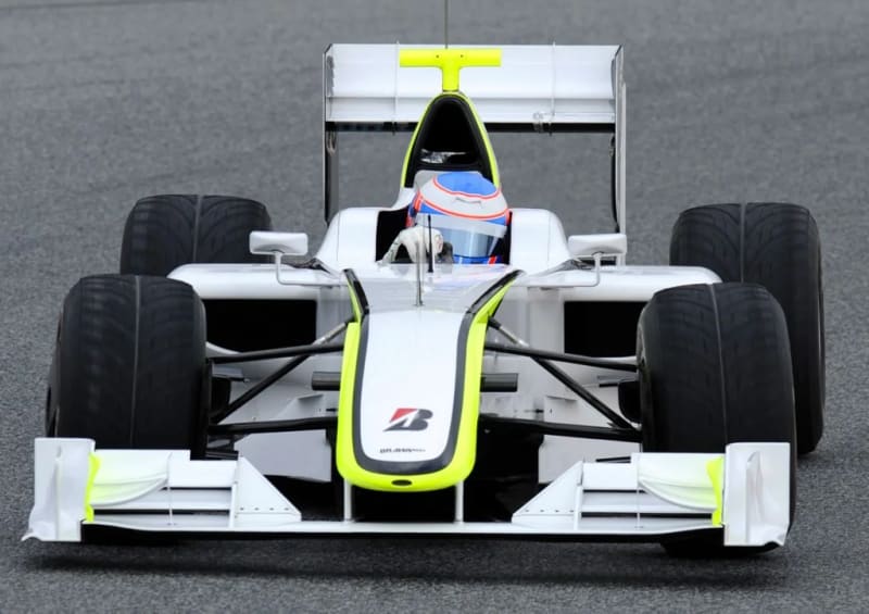 ** Jenson Button celebrating in Brawn GP racing car after championship victory