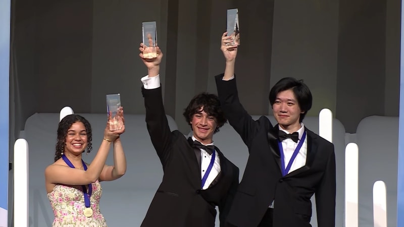 Young student Matteo Paz working on computer analyzing space telescope data