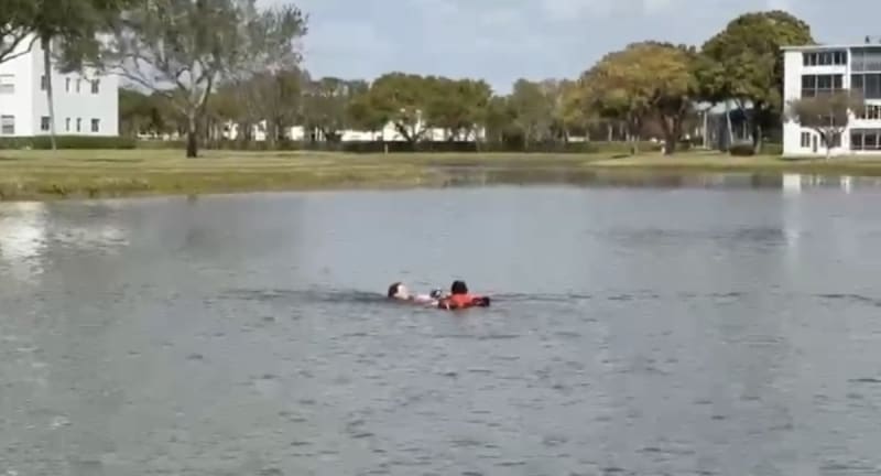 Firefighter Captain Anthony from Boca Raton Station 53 after rescuing small dog from lake