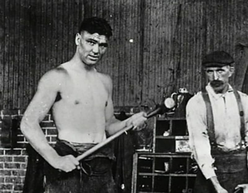 Jack Dempsey in his prime as heavyweight champion, displaying the strength and charisma that made him legendary