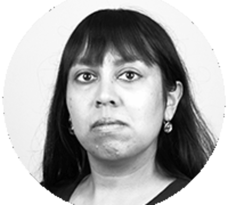 Solar panels and wind turbines against blue sky representing China's renewable energy expansion