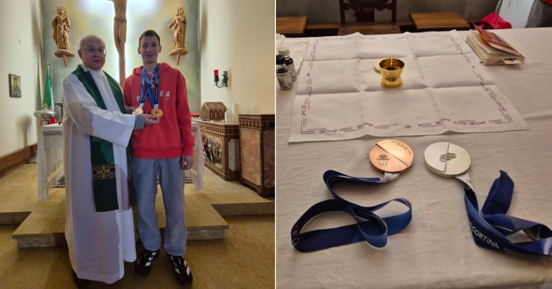 Young Polish Olympic ski jumper Kacper Tomasiak standing with Father Edward Pleń at Mass in Italy