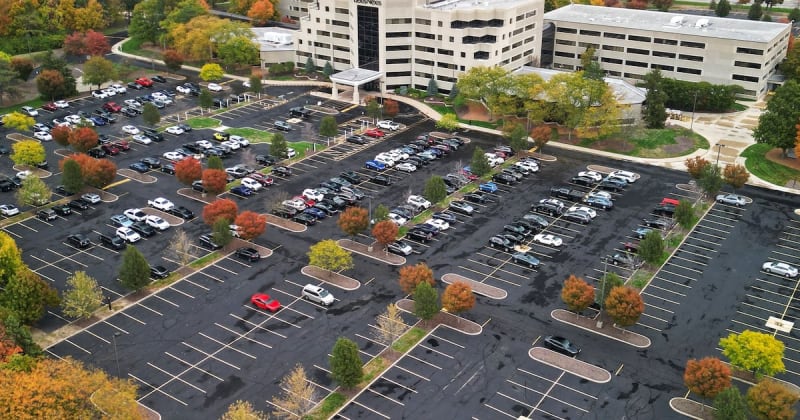 Aerial view of modern office campus with green spaces and parking areas in Miami Township Ohio