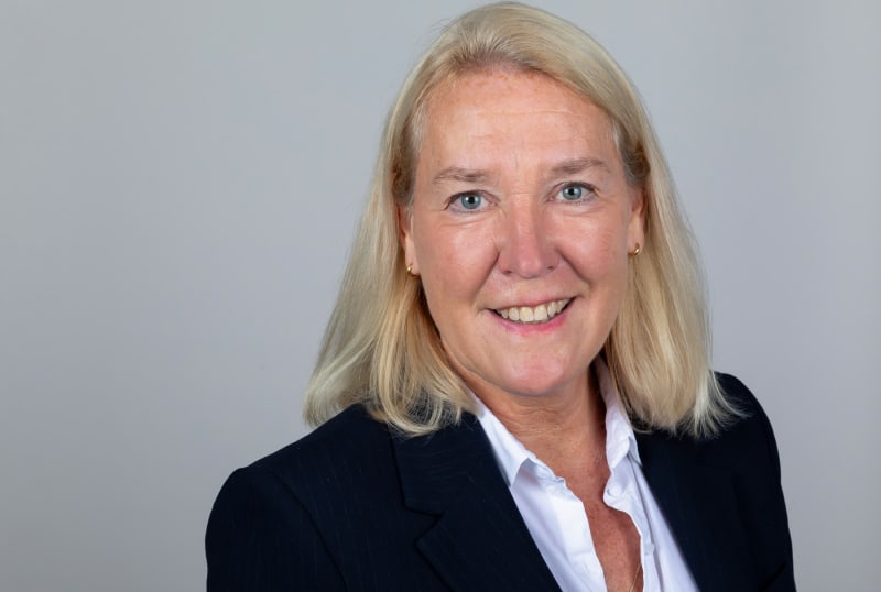 Diverse group of professional football players standing together in solidarity, representing collective action for fair employment rights