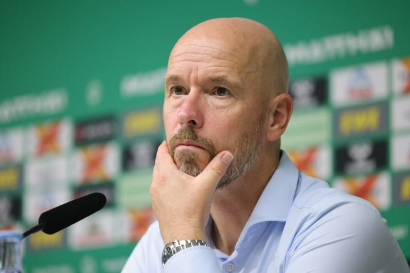 Erik ten Hag smiling in FC Twente colors, representing his return to his hometown football club in Enschede