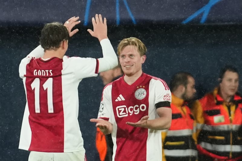 Oliver Edvardsen celebrates his late winning goal with teammate Mika Godts in the rain