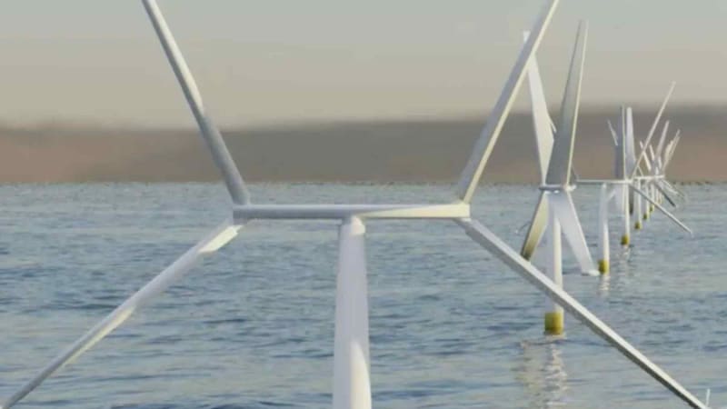 X-shaped hybrid wind turbine design with vertical and horizontal rotors against blue sky