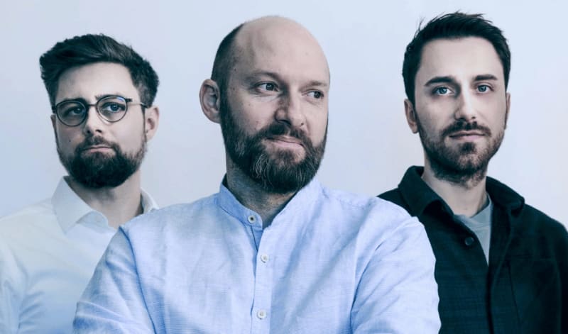 ** Solar panels installed over farmland with crops growing beneath in sustainable agri-photovoltaic system