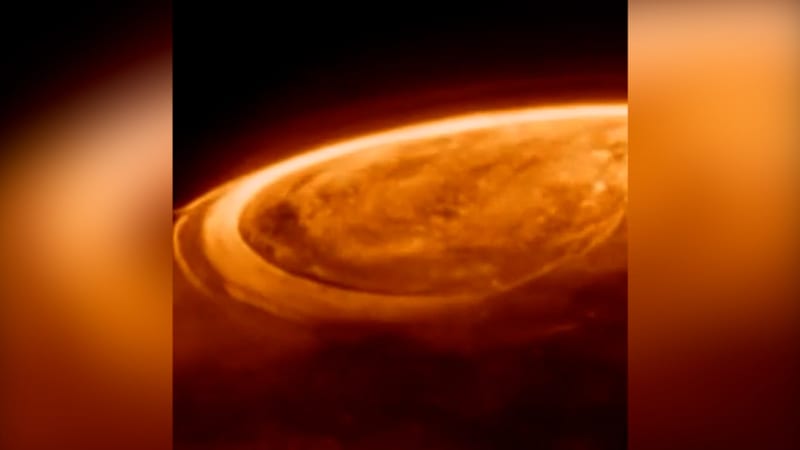 Artist rendering of glowing donut-shaped dust ring surrounding supermassive black hole in deep space