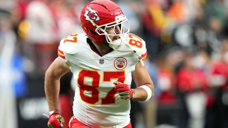Travis Kelce in Kansas City Chiefs uniform during a game on the field