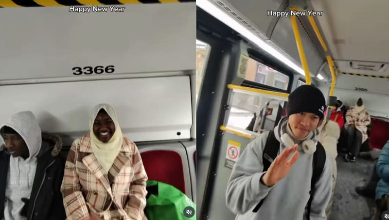 Man wearing glasses smiling while greeting passengers on Toronto public transit