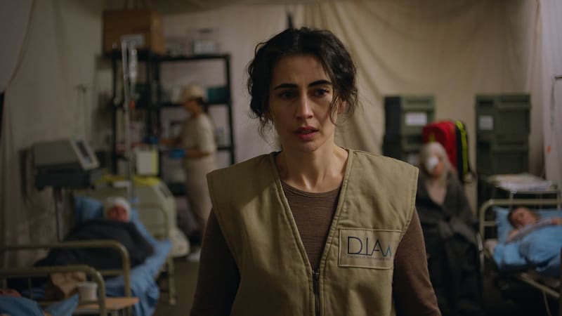 Film still showing Kurdish-Finnish family members in emotional conversation spanning three generations