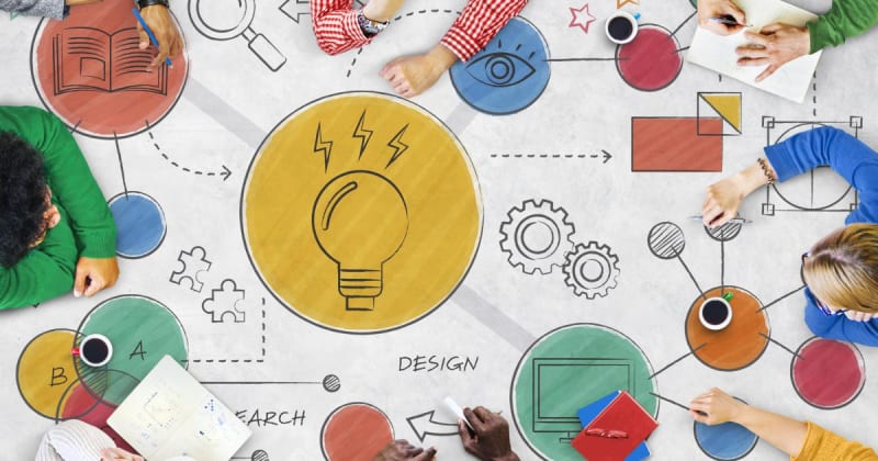 Teachers collaborating and sharing ideas in a school common area